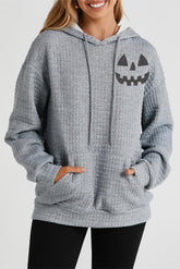 Pumpkin Face Graphic Drawstring Hoodie with Pocket Charcoal OutfitFlow