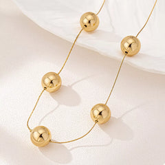 Golden Sphere Statement Necklace OutfitFlow