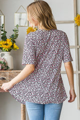 Heimish Full Size Short Sleeve Crisscross Animal Babydoll Top Plus Size OutfitFlow