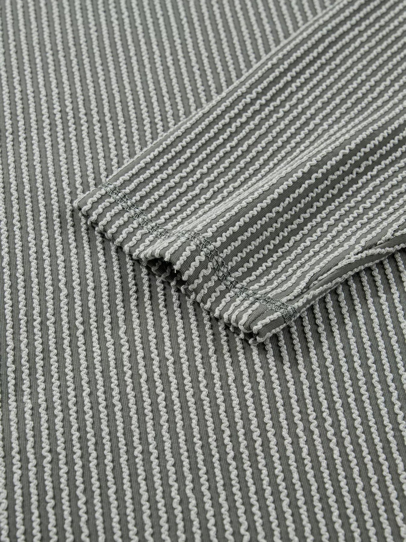 Twist Ribbed Exposed Seam Detail Long Sleeve Loose Top OutfitFlow