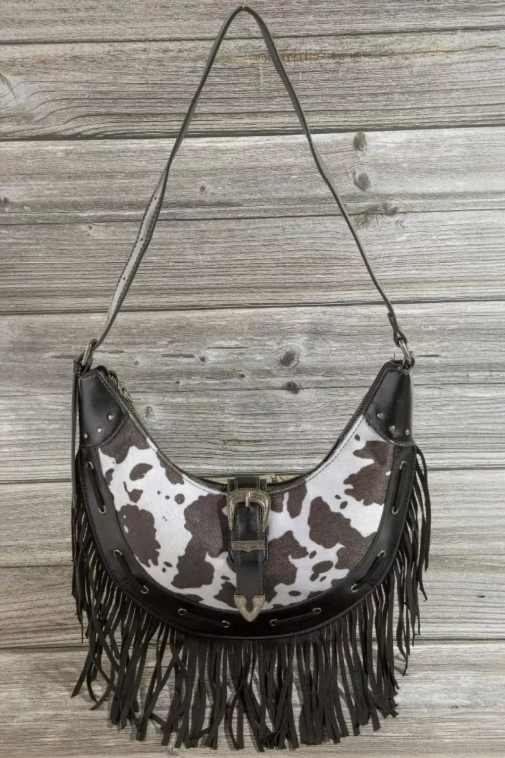 Fame Cow Print Faux Leather Fringe Hobo Bag OutfitFlow