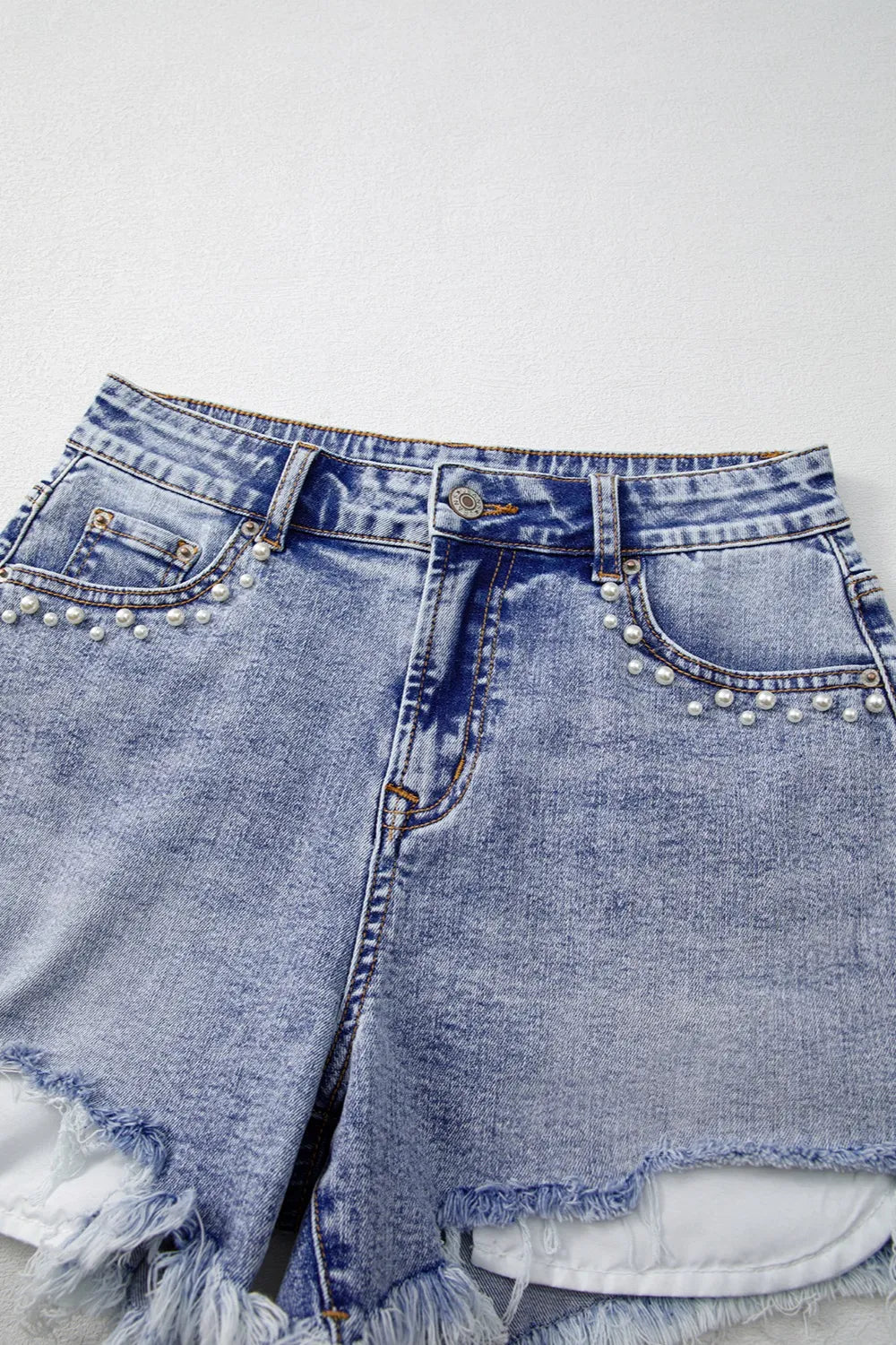 Pearl Studded Pockets Raw Hem Denim Shorts OutfitFlow
