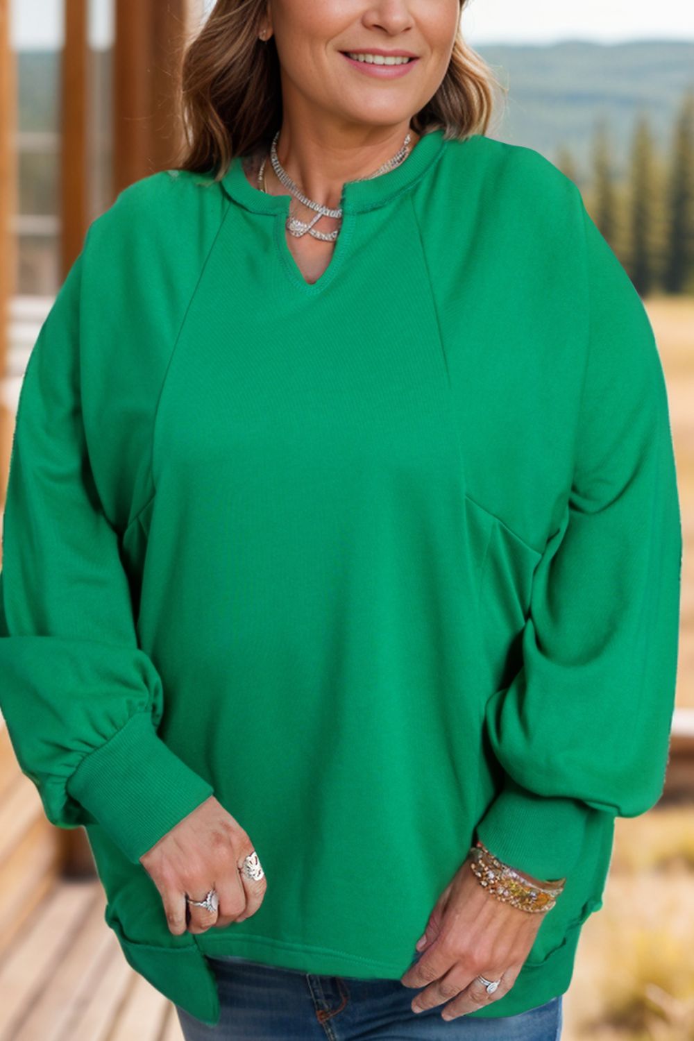 Outfit Flow - Plus Size Cutout Hem Notched Long Sleeve Sweatshirt