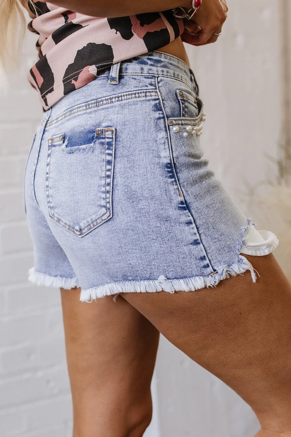 Pearl Studded Pockets Raw Hem Denim Shorts OutfitFlow
