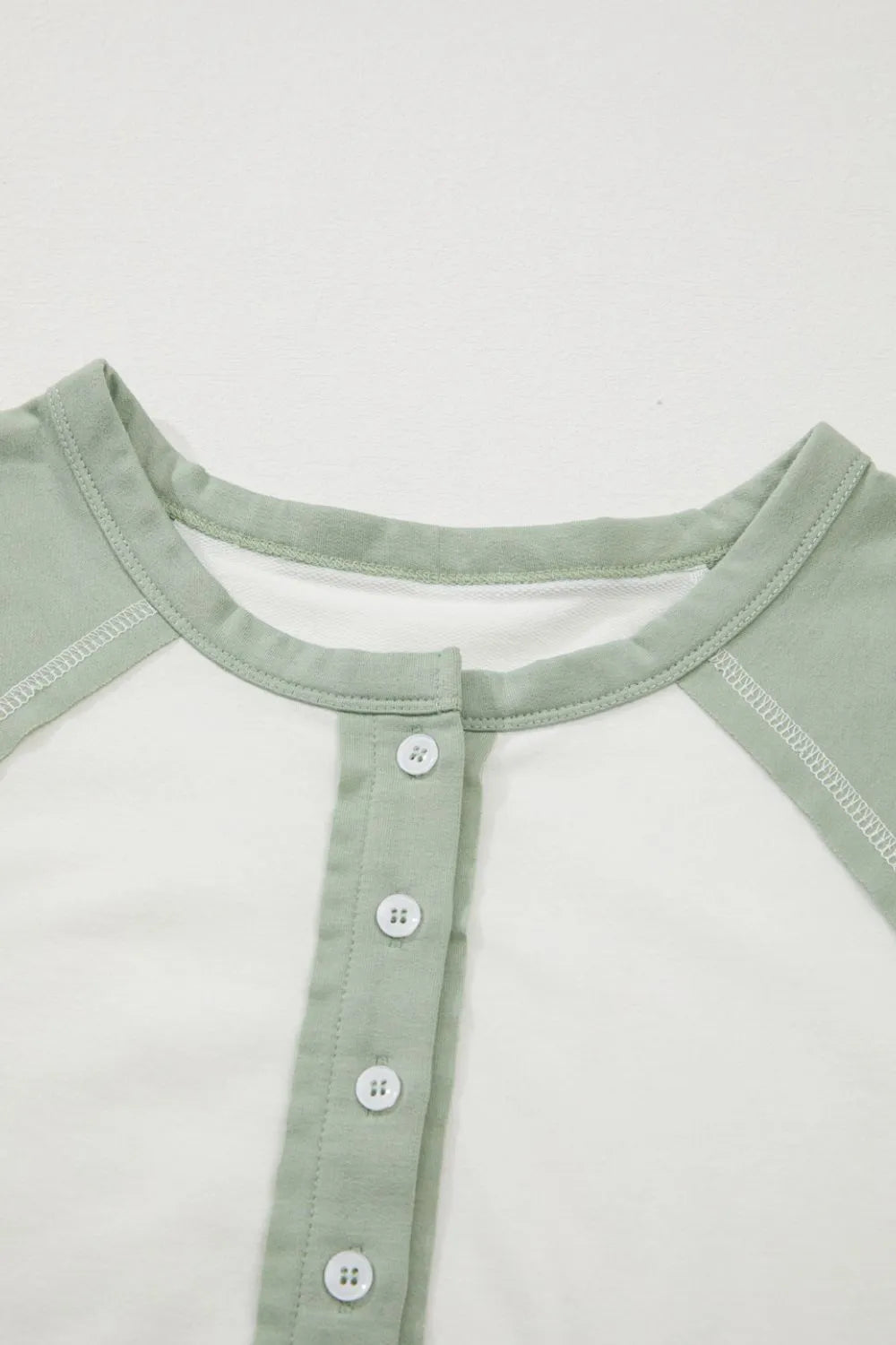 Color Block Raglan Short Sleeve Half Buttons High Low T Shirt OutfitFlow
