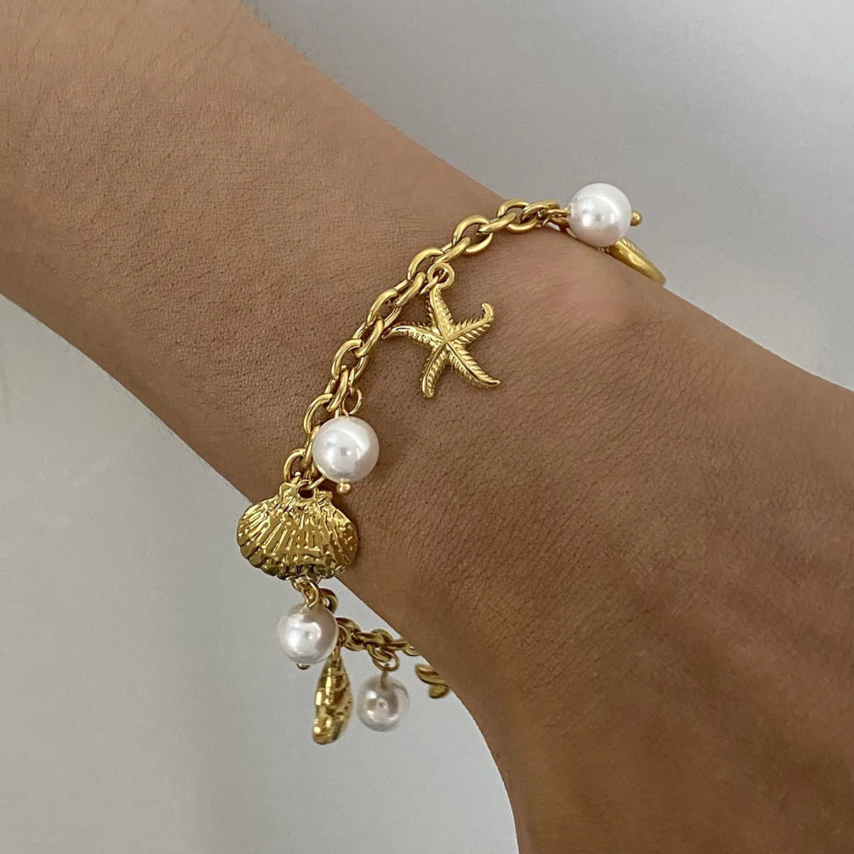 Ocean Theme Stainless Steel Chain Bracelet with Seashell and Starfish Pendants Gold One Size OutfitFlow