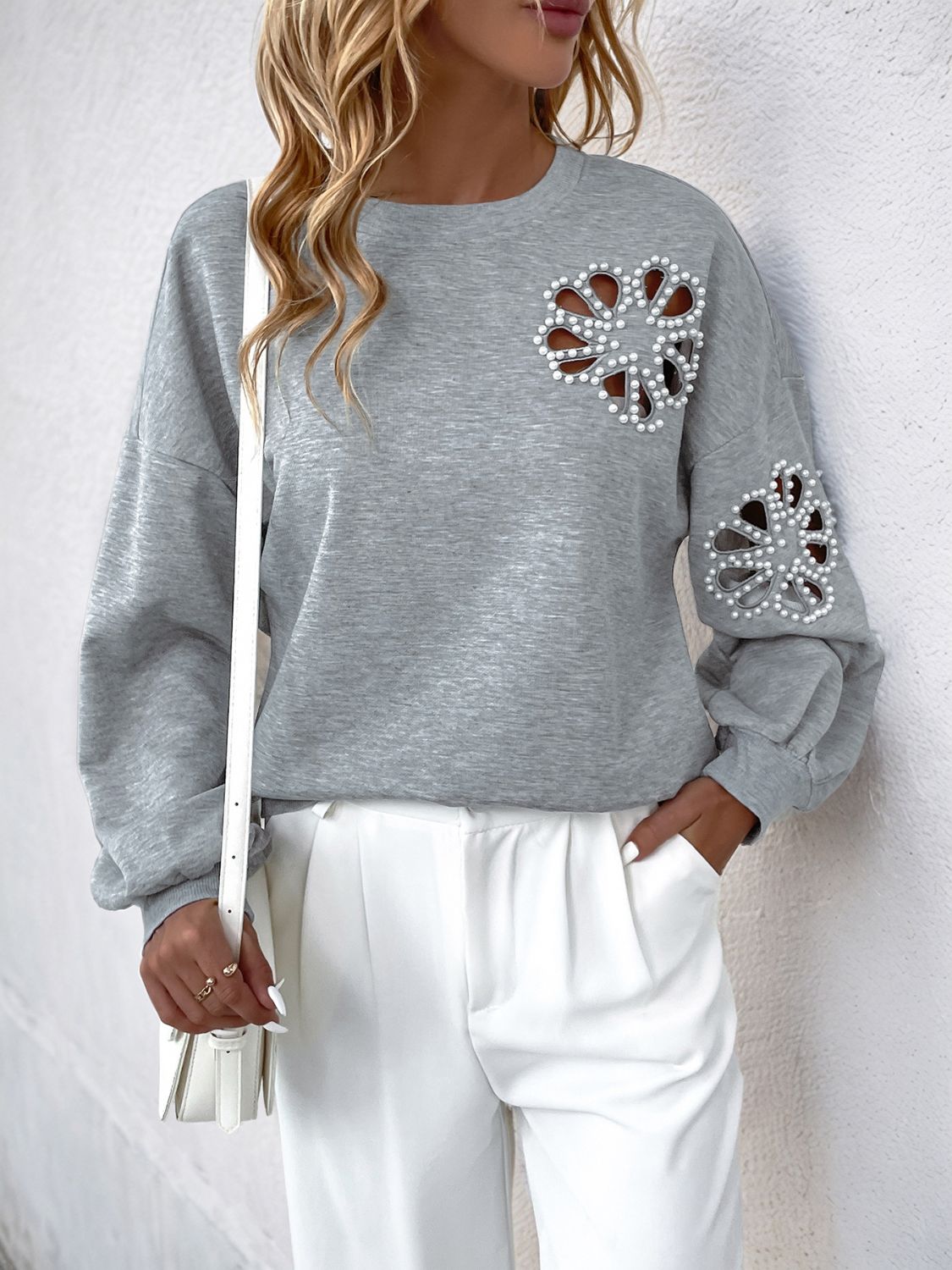 Outfit Flow - Perfee Cutout Pearl Round Neck Long Sleeve Sweatshirt