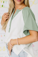 Color Block Raglan Short Sleeve Half Buttons High Low T Shirt OutfitFlow
